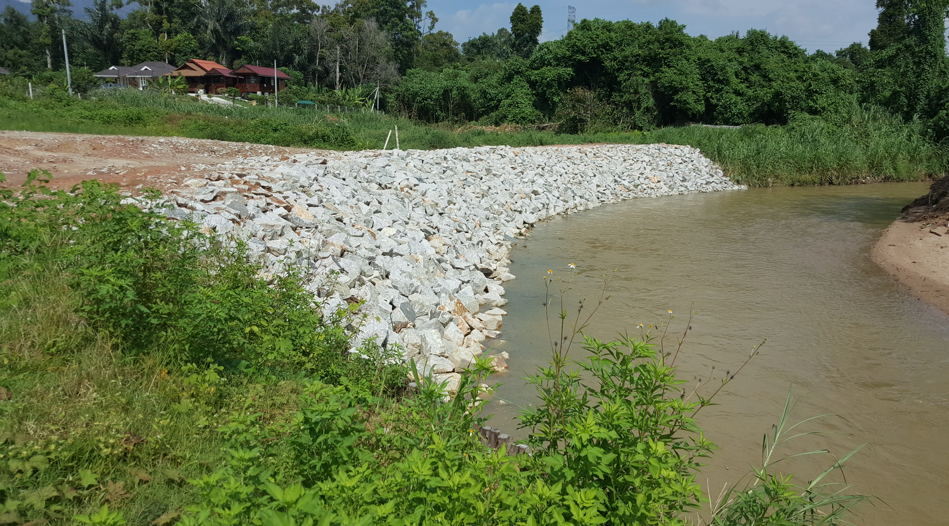 A river with a lot of rocks on the side of it.