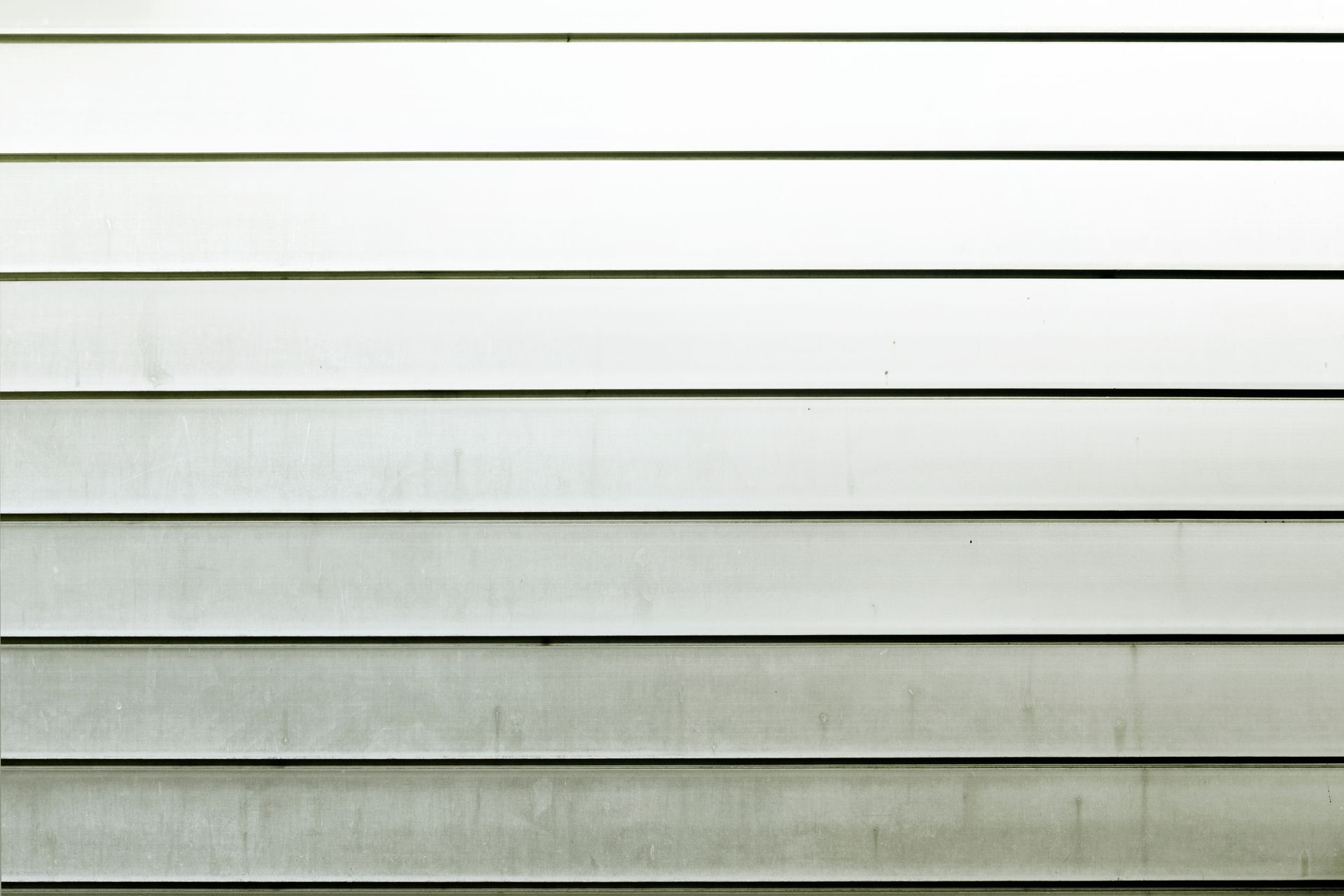 A close up of a white siding on a house.