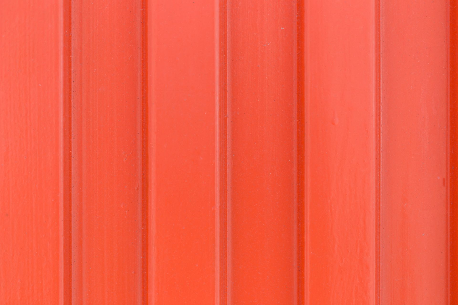A close up of a red wooden wall.
