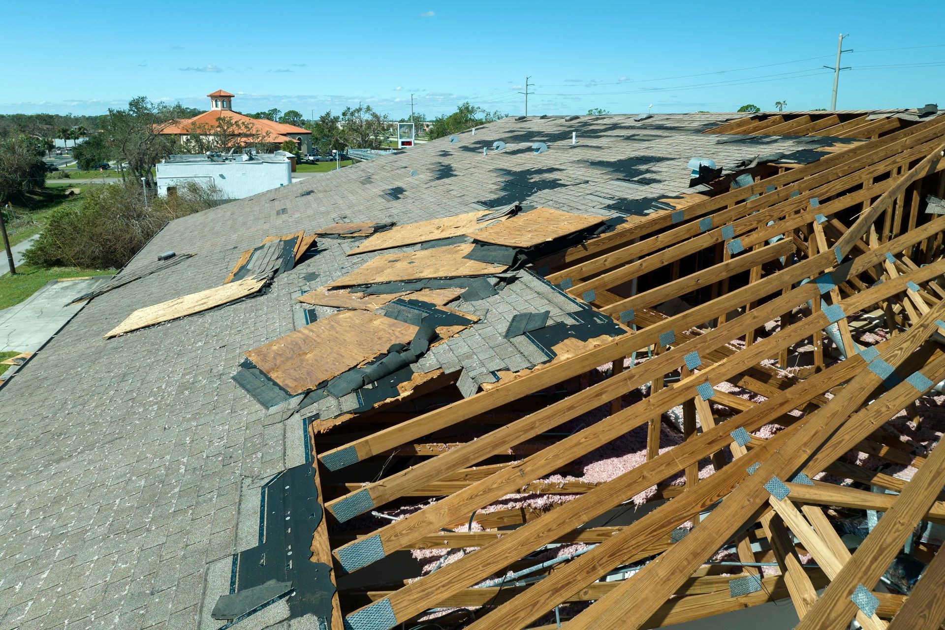 A roof with a lot of wooden beams on it