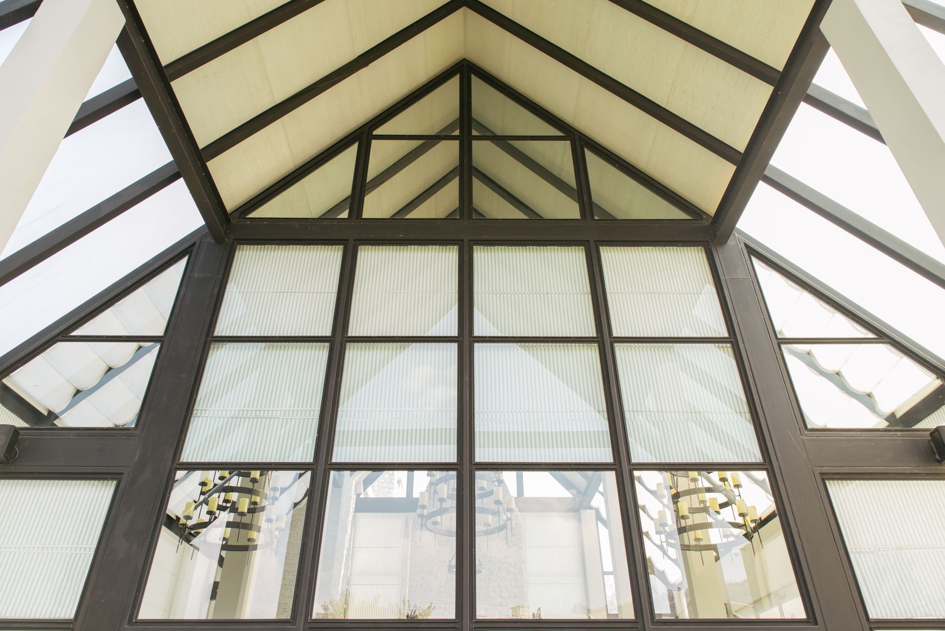 A building with a roof that has a lot of windows