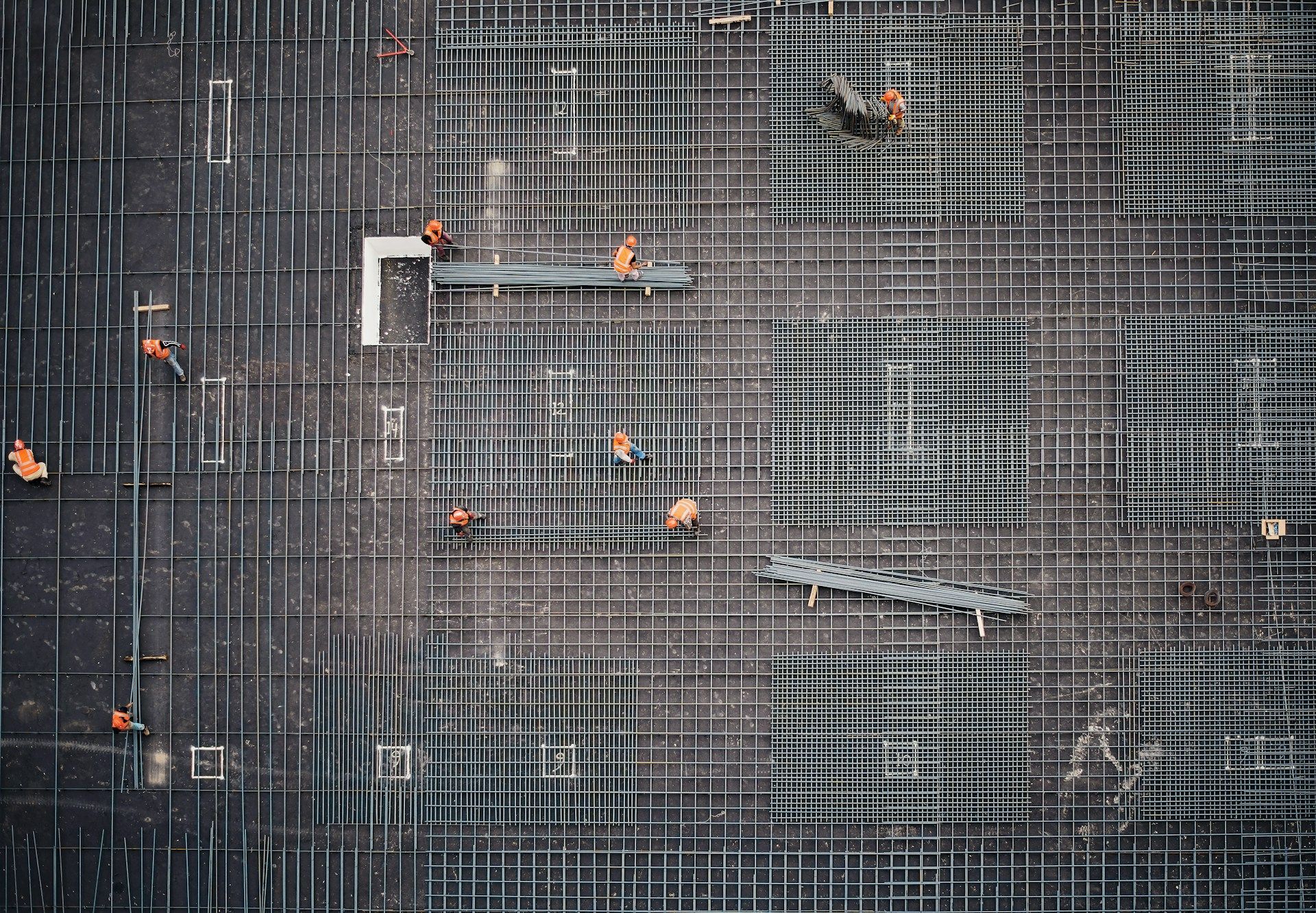 An aerial view of a construction site with workers.