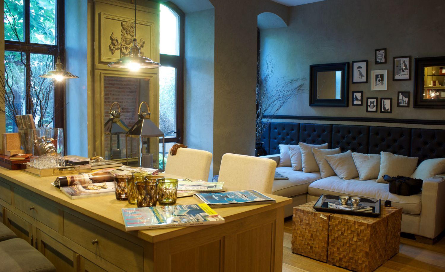 A living room with a couch , table and chairs