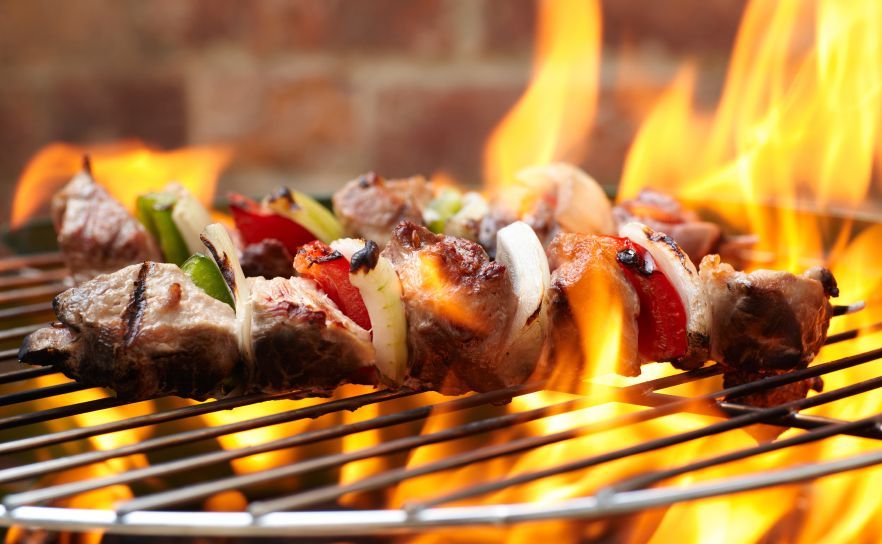 kebabs on a BBQ with fire
