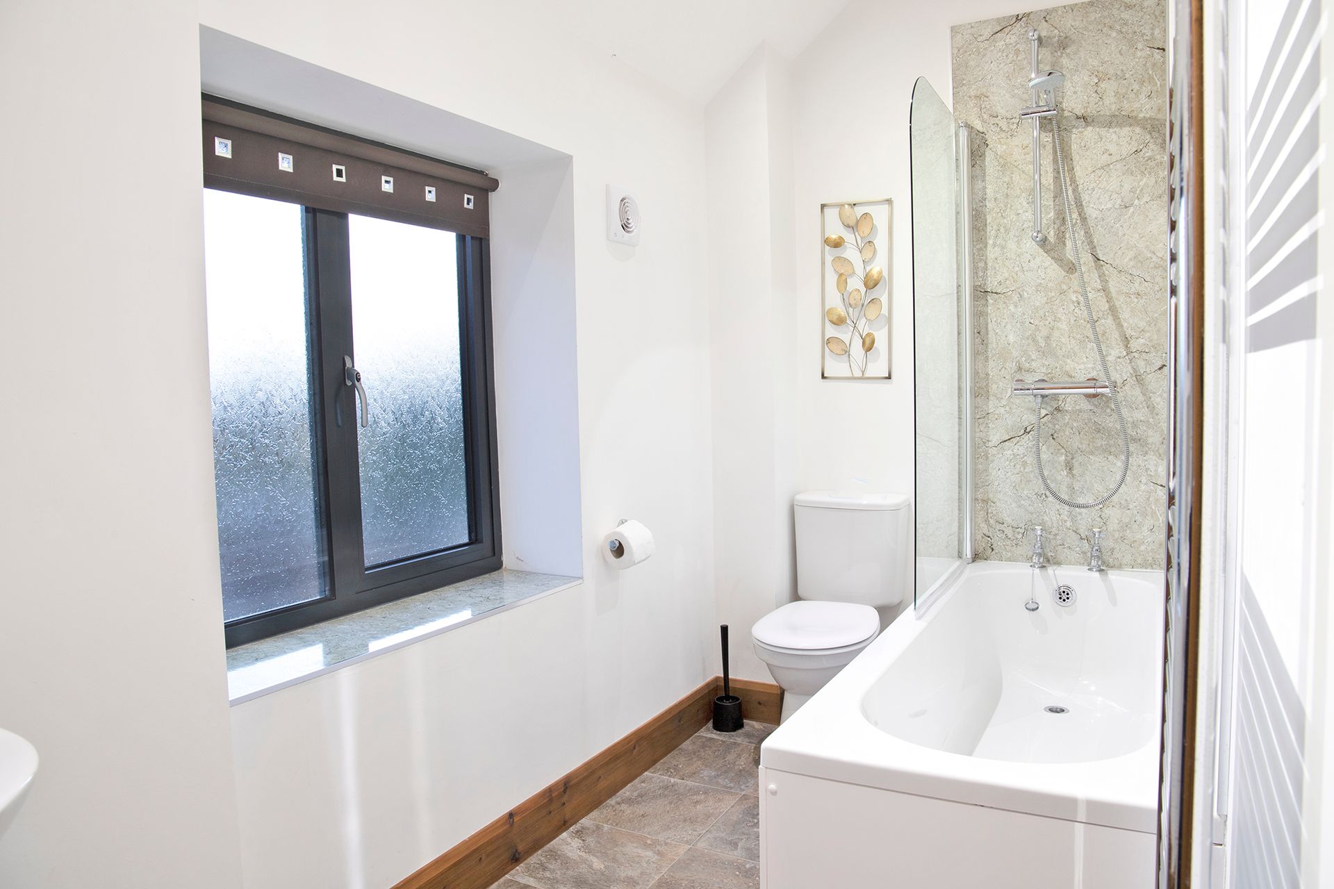 bathroom with bath and shower and toilet