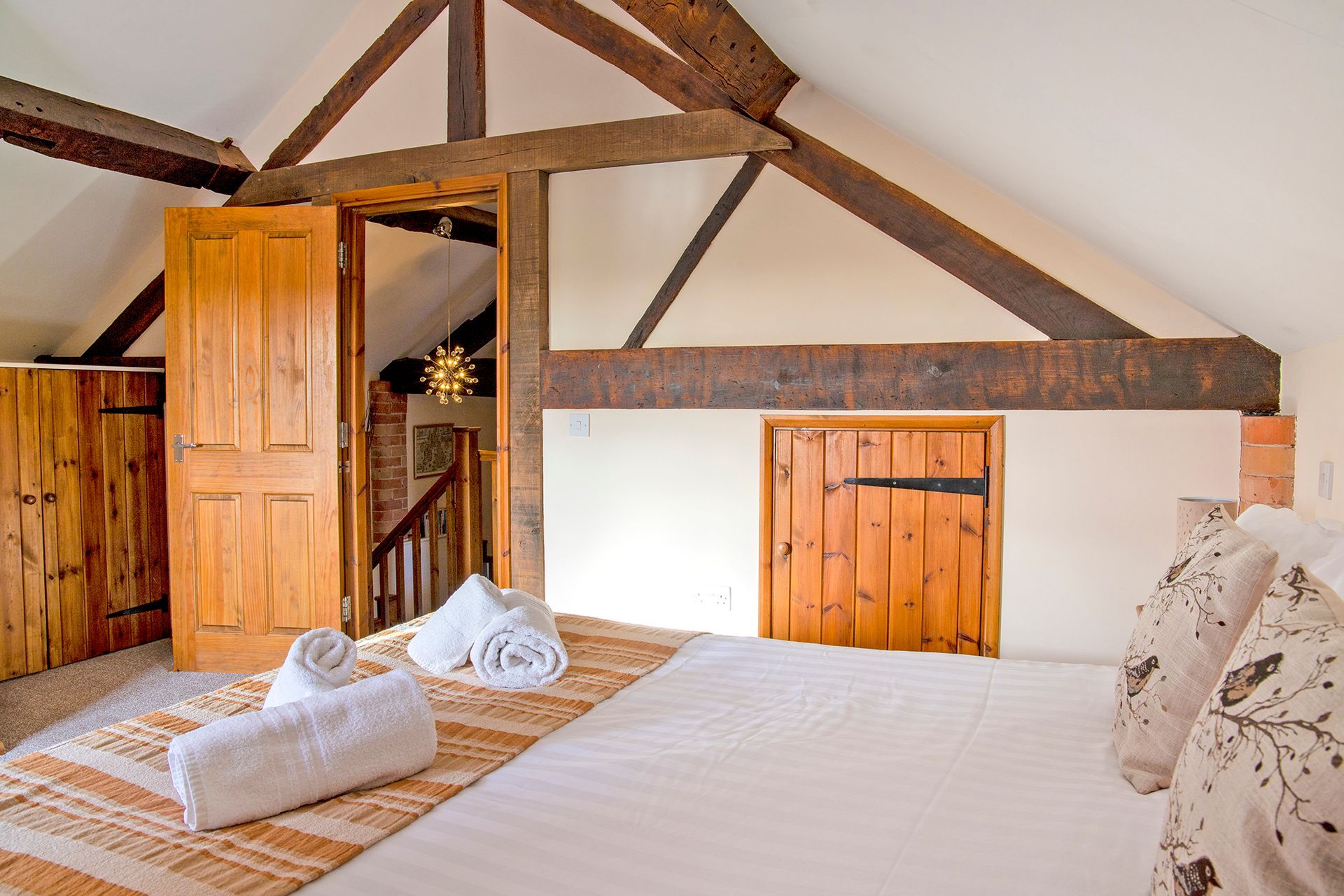 Bedroom with oak beams and wooden door