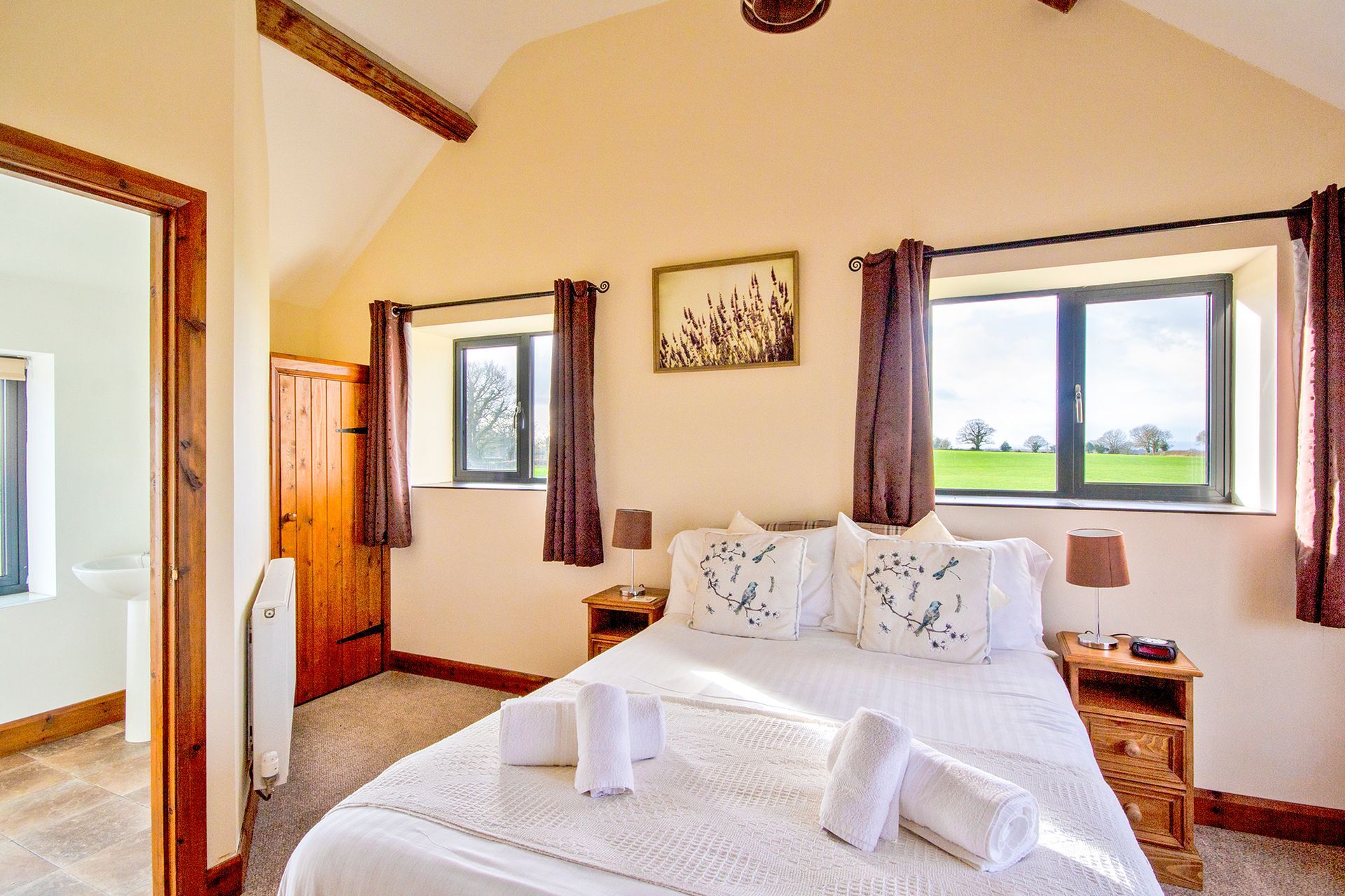 Double bedroom with two windows with countryside views