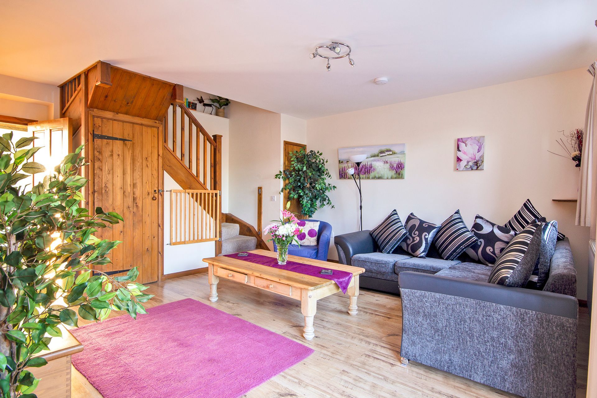 Sitting room with open wooden staircase