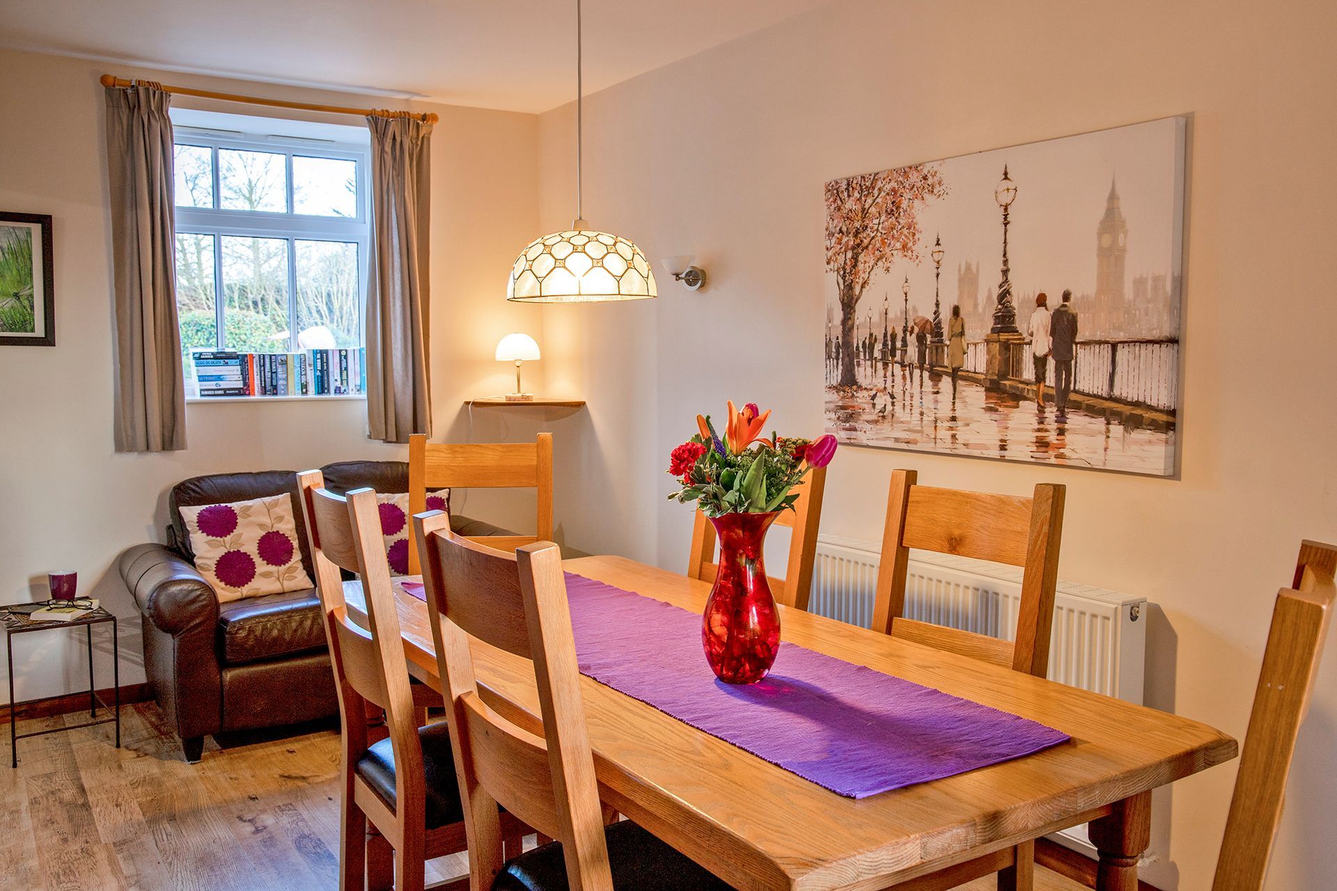 Dining table with a vase of flowers