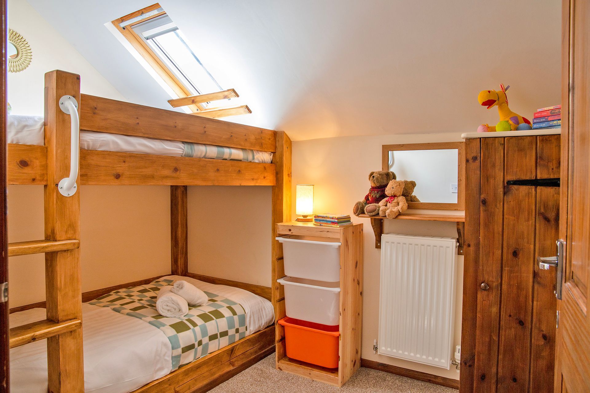Children's Oak bunkbeds with teddy bears and book 