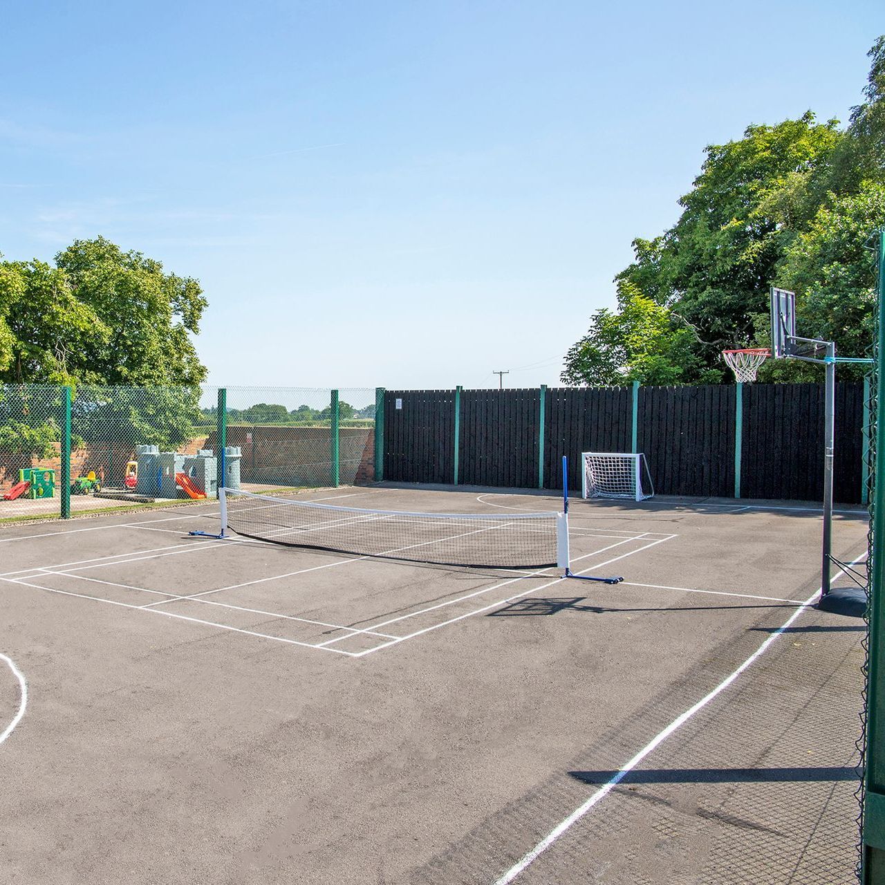 Multi Sports Court at Alkington Grange Barns Sports court with tennis net, basket ball net and football nets