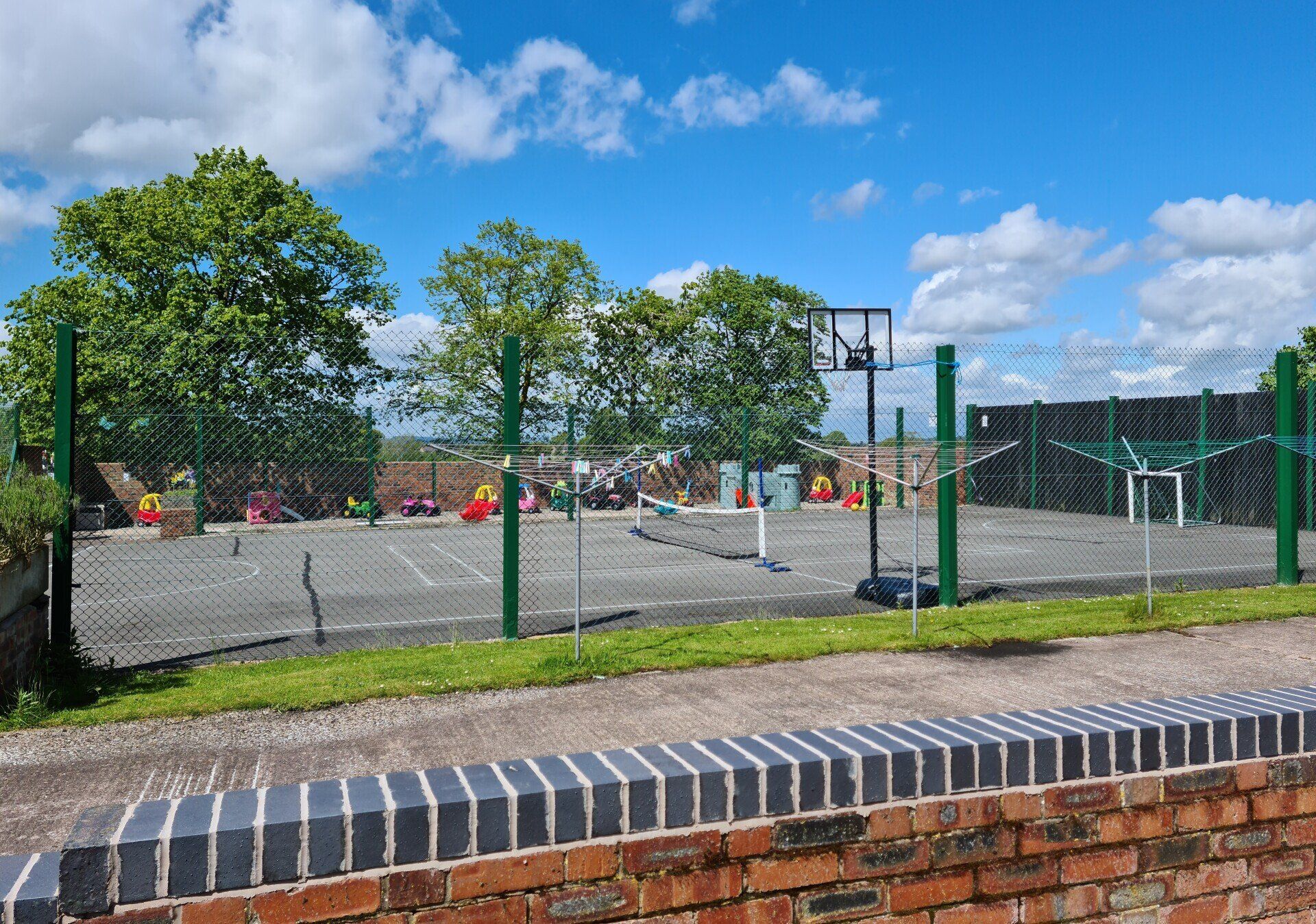 Sports court with basketball net, tennis net and football nets