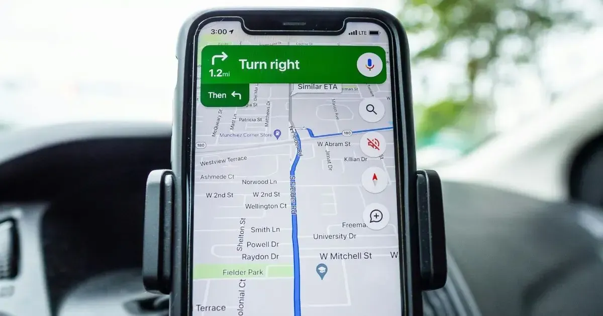 A smartphone mounted in a car, hinting at the importance of having a Google Business Profile.