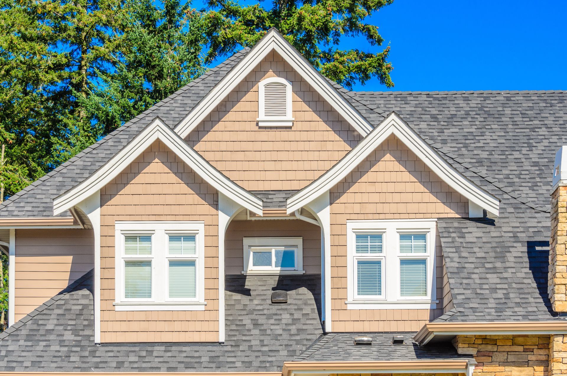 The roof of the house with nice window.