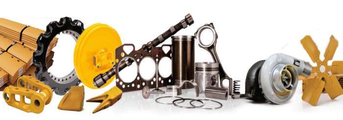 A bunch of different types of tractor parts on a white background.