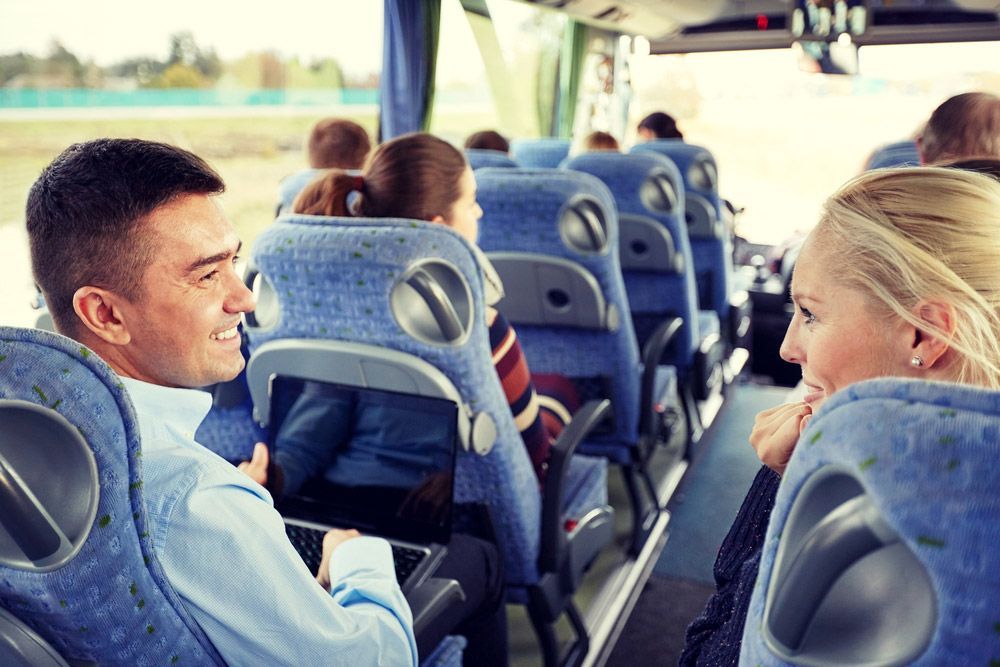 Group Of Happy Passenger In Bus — Shuttle Buses from Hervey Bay in Dundowran Beach, QLD
