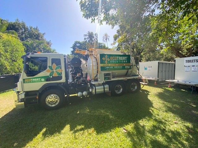 Vacuum Truck Parked on Green Lawn — Ecotreat Solutions NT in Winnellie, NT