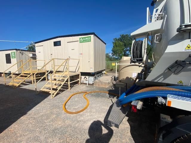 Portaloo Beside a Waste Water Truck at Ecotreat Solutions NT — Ecotreat Solutions NT in Winnellie, NT