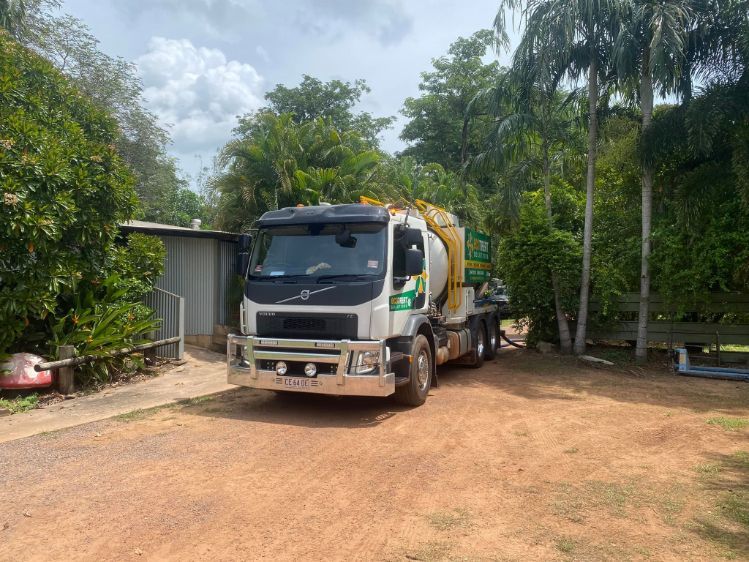 A work truck is parked in a dirt driveway— Ecotreat Solutions NT in Winnellie, NT