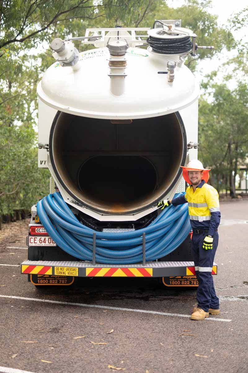 Worker Beside Vacuum Truck at Ecotreat Solutions NT — Ecotreat Solutions NT in Winnellie, NT
