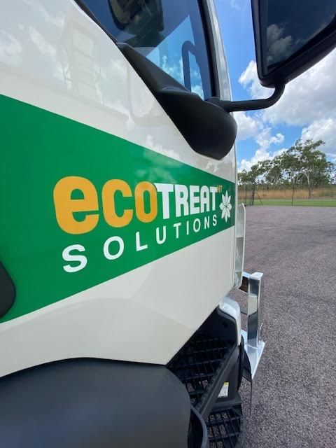 A White Truck With a Green and Yellow Sticker That Says Ecotreat Solutions — Ecotreat Solutions NT in Howards Springs, NT