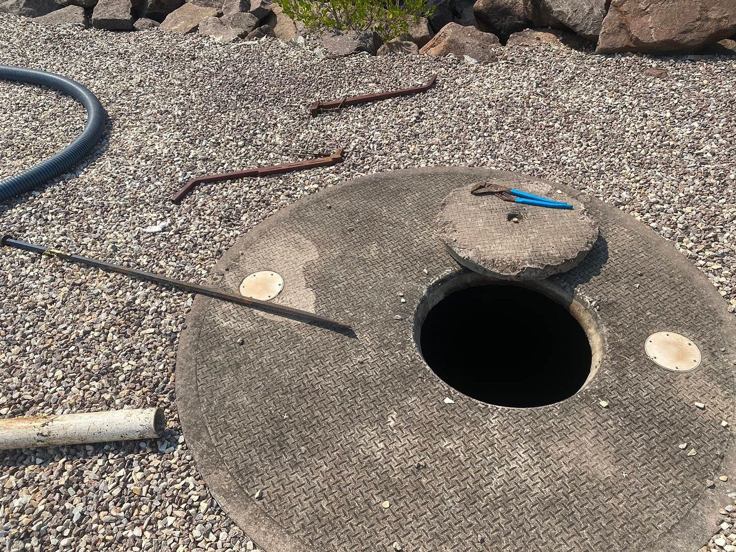 Open Septic Tank Access Cover Showing Need For Routine Maintenance