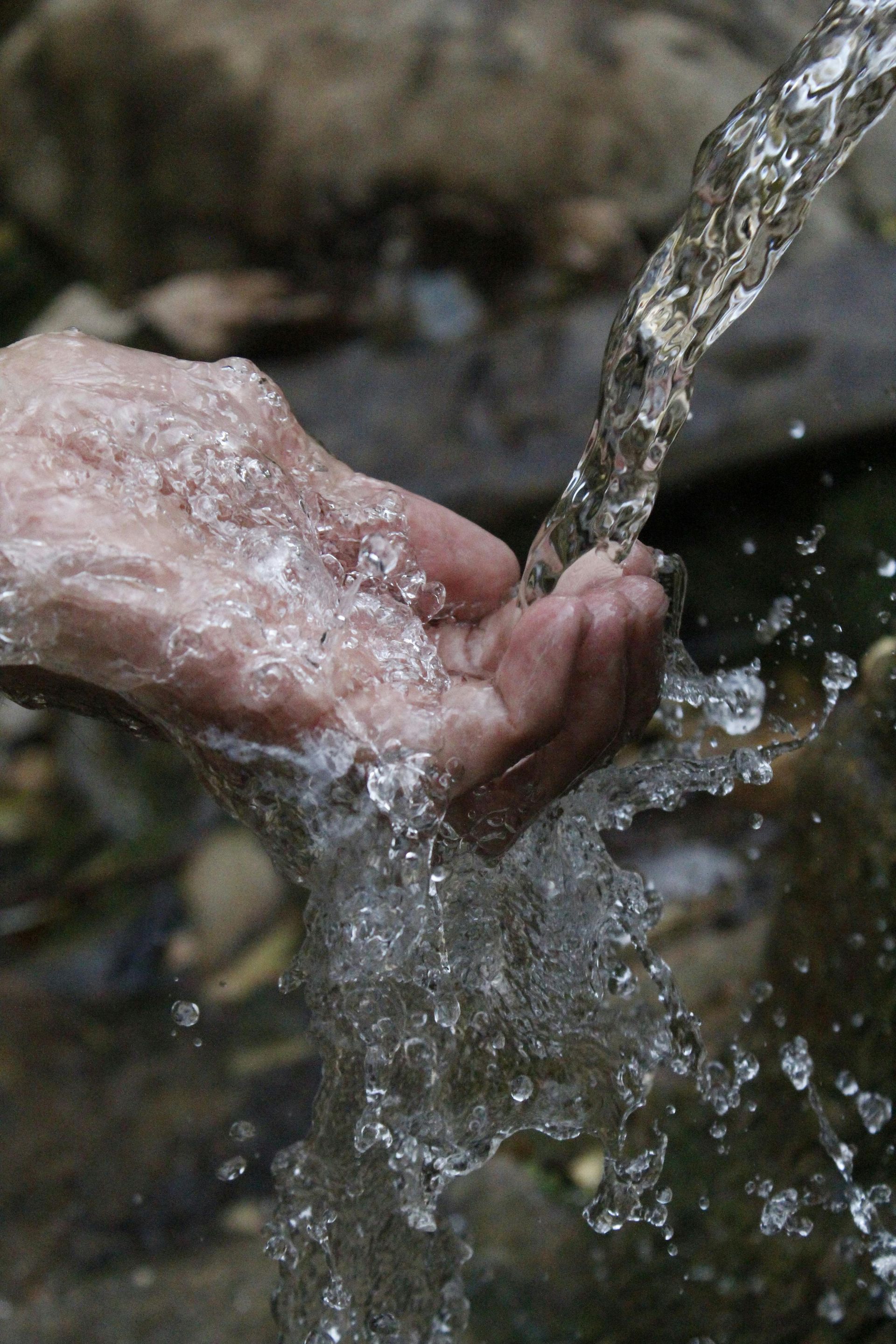 water running over a hand - Ecotreat Solutions NT
