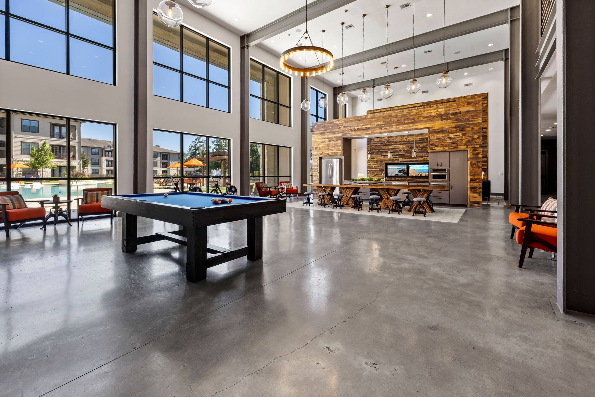 There is a pool table in the middle of the room.