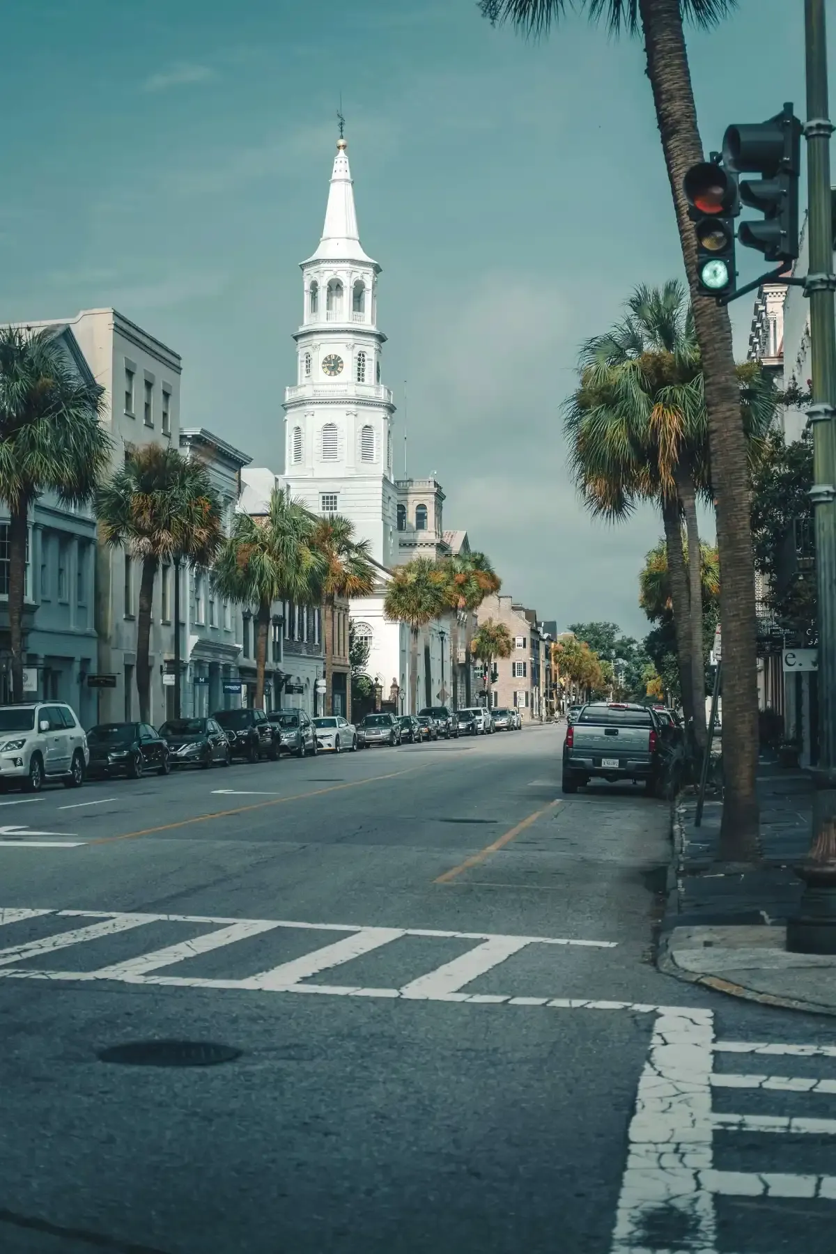 A city street with a clock tower in the background