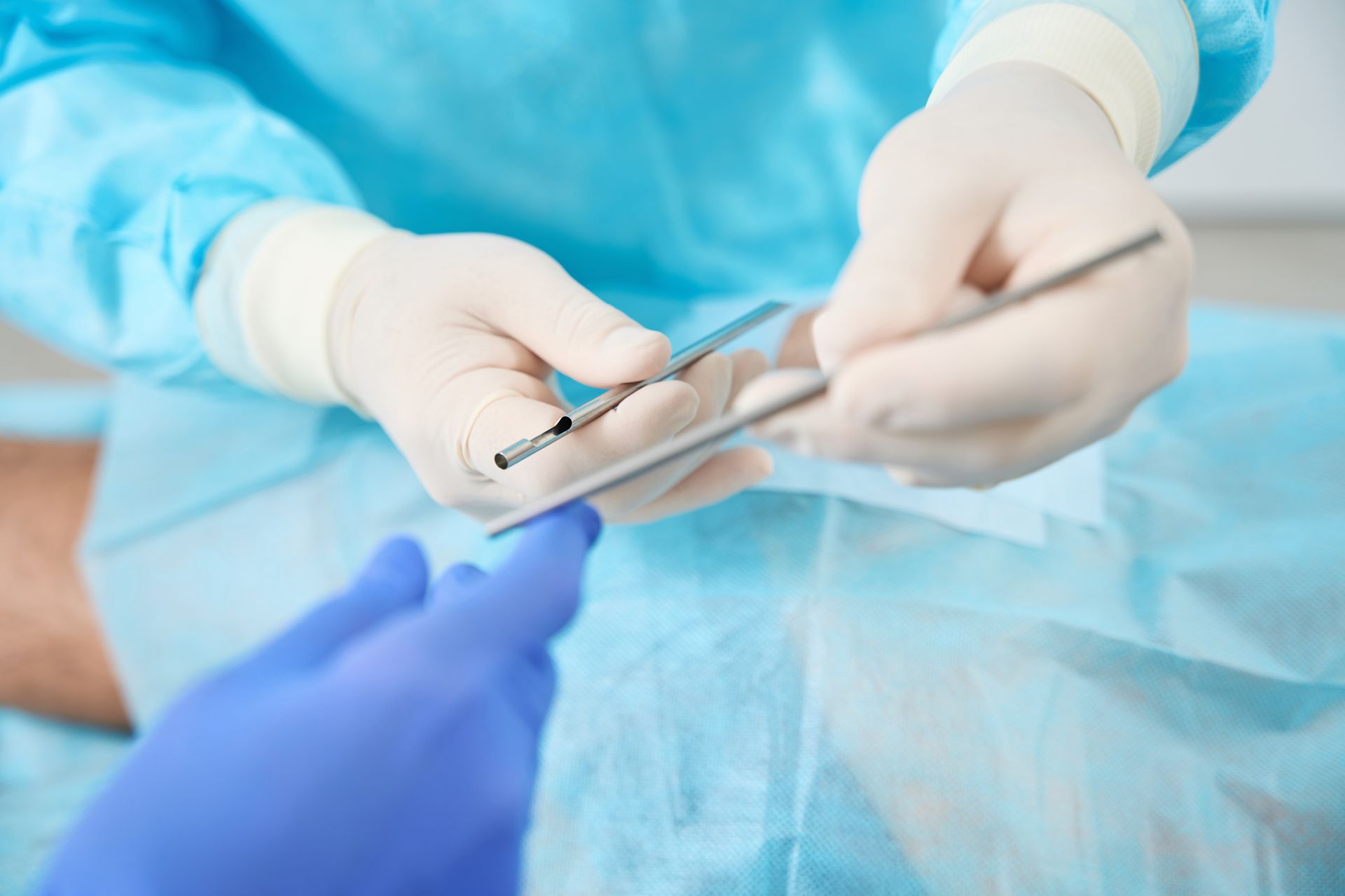 Close up of doctor hands holding tools for hormone replacement therapy in bioidentical use setting. Close up of doctor hands holding tools for hormone replacement therapy in bioidentical use setting.