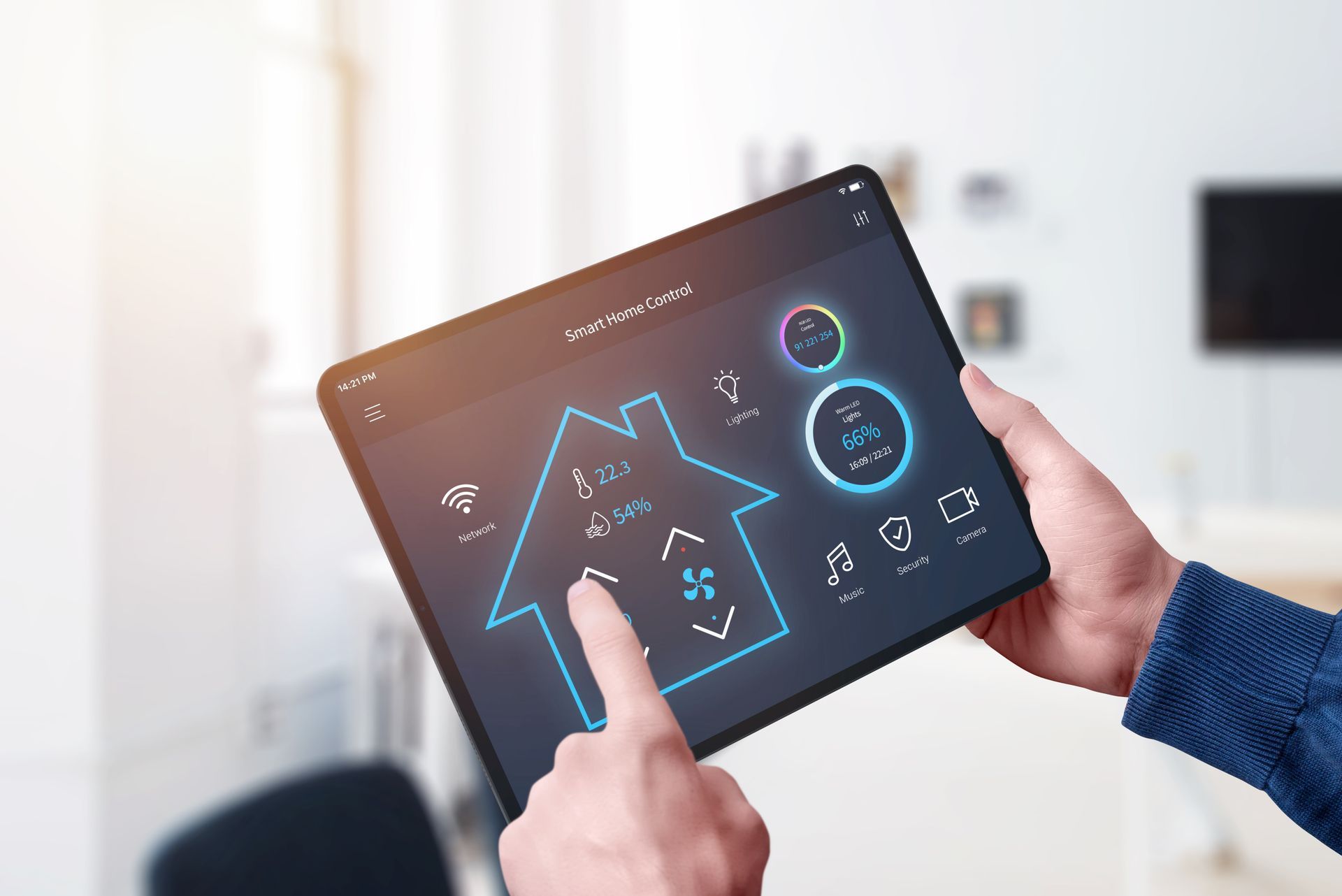 Hands using a tablet with a smart home control dashboard in a bright room