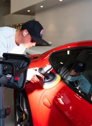 Jackson paint correcting a red Ferrari in La Jolla CA