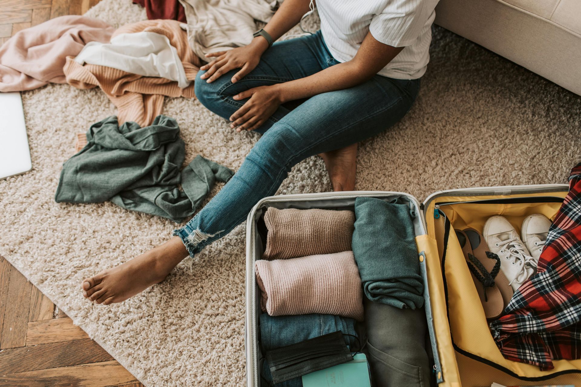 black woman packing her suitcase