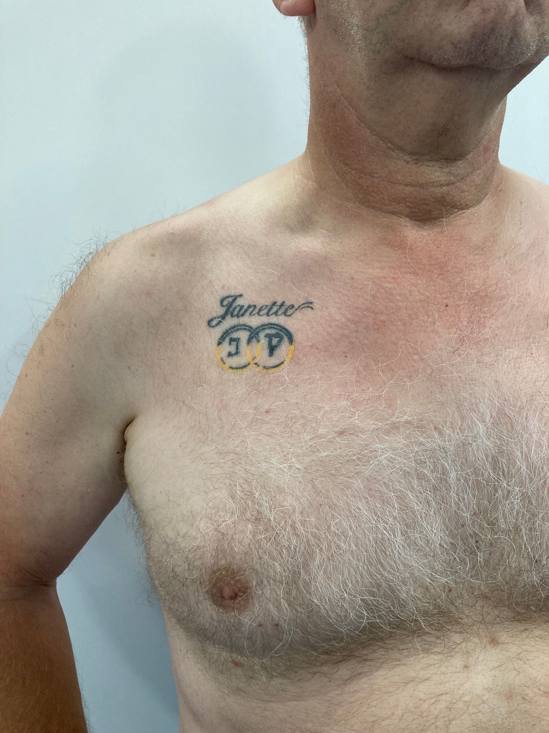 A Man Without a Shirt Has a Tattoo on His Chest — La Bomba Loca Tattoo in Cairns City, QLD
