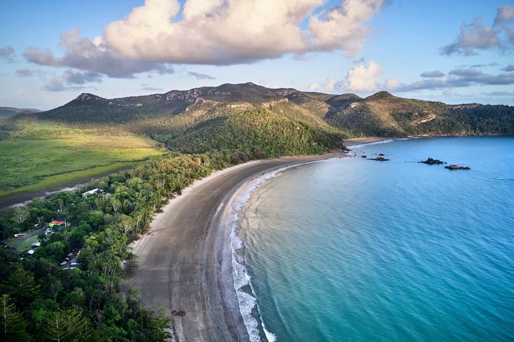 An Aerial View of a Tropical Beach With Mountains in the Background — Norfab In Mackay, QLD
