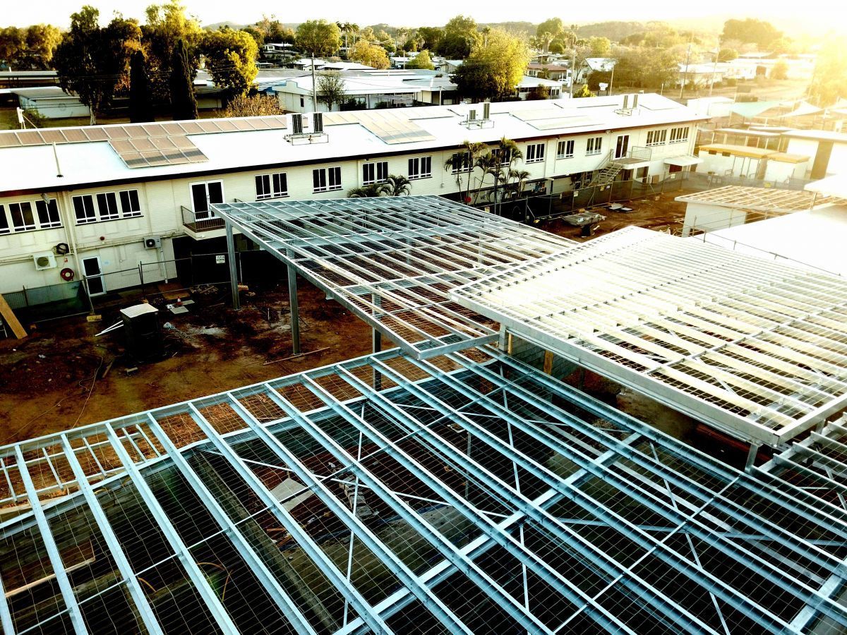 Construction Site With Exposed Metal Framework Extending From A Building — Custom Steel Fab in Garbutt, QLD
