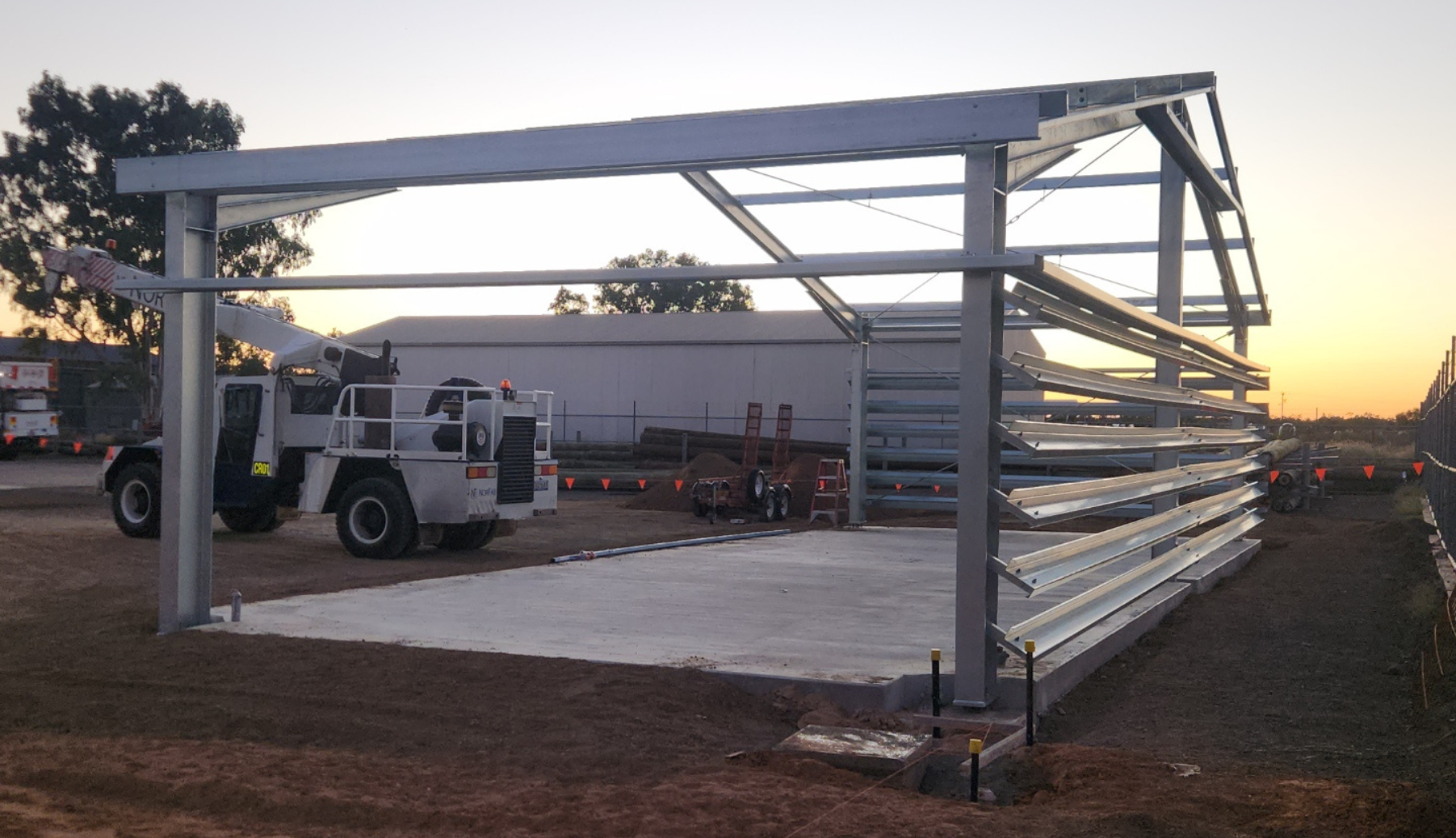 A Large Crane is Sitting in Front of a Building Under Construction — Norfab In Bohle, QLD