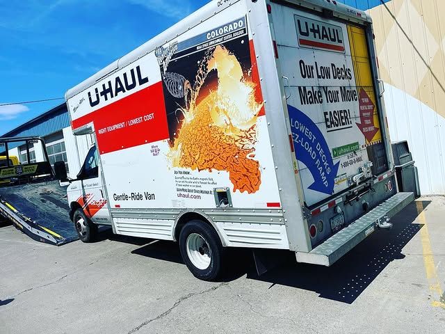 AT Towing truck staged at a commercial property
