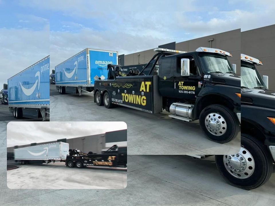 AT Towing tractor moving loaded trailers at a distribution yard