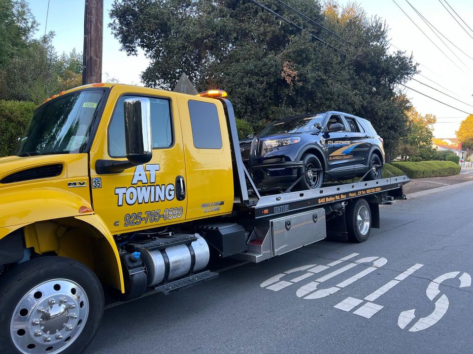 Heavy equipment loaded by AT Towing