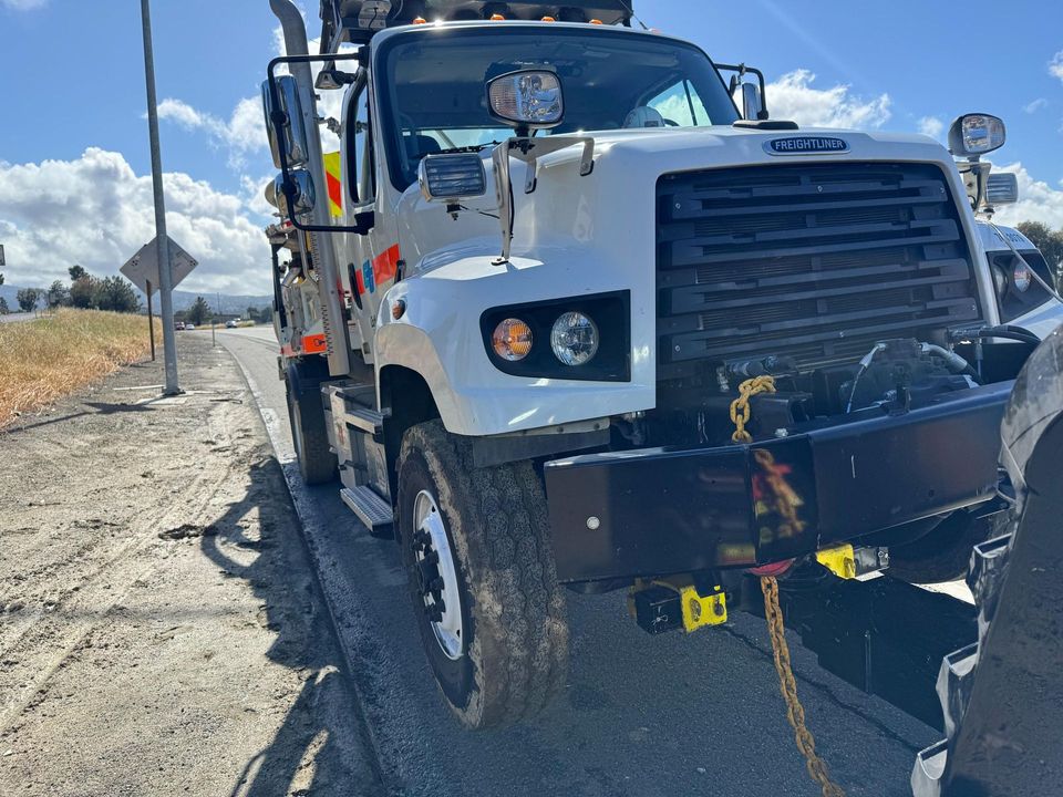 AT Towing service truck rigged for a roadside recovery