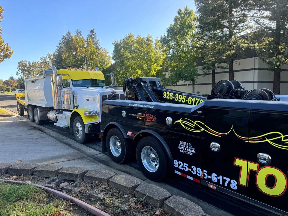 AT Towing truck and recovered vehicle