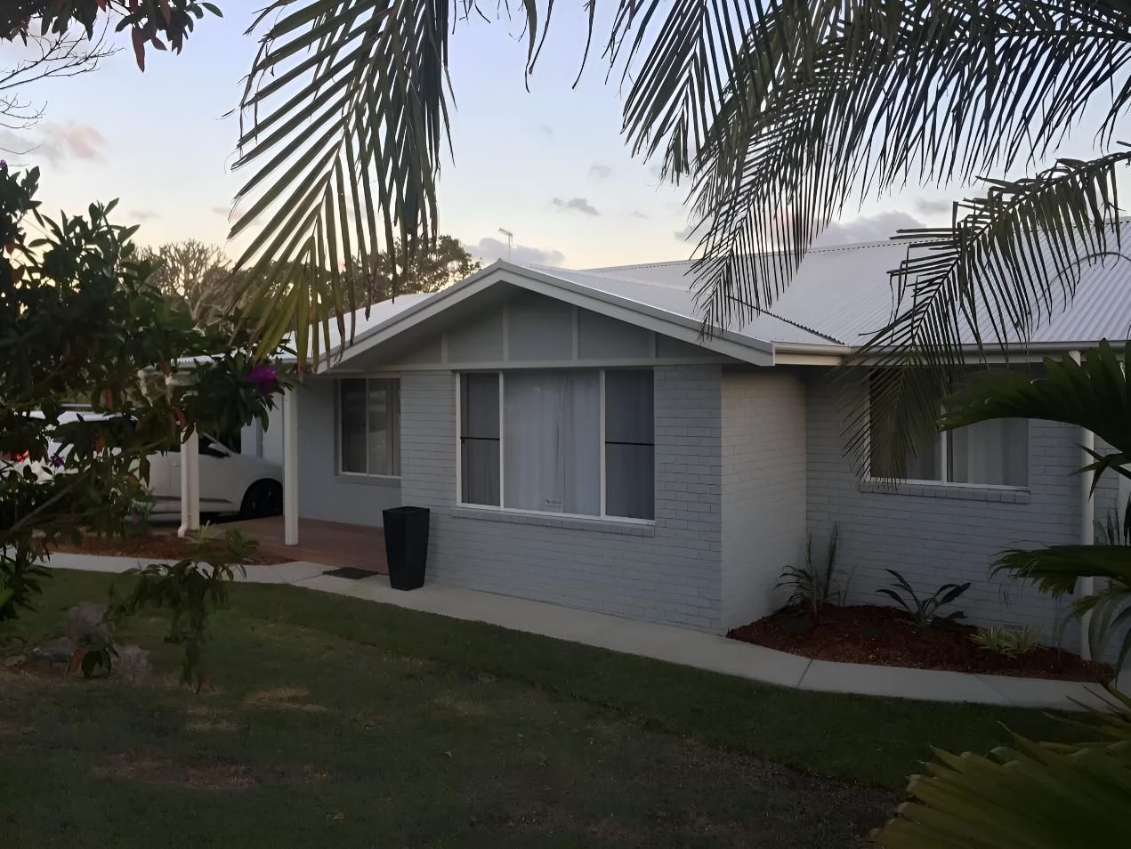 A White House With a White Car Parked in Front of It  — Aspex Construction - Lou Pieren In Port Macquarie, NSW