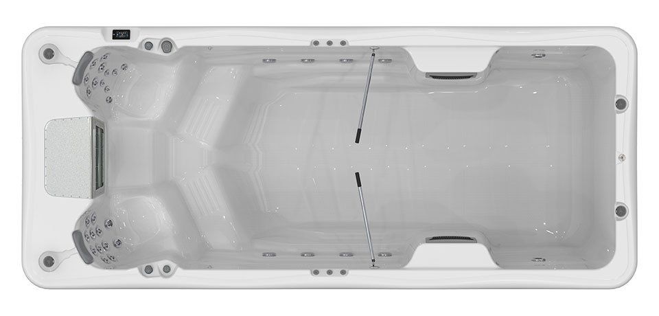 Top-down view of a long, rectangular swim spa with two seated areas and a swim area.