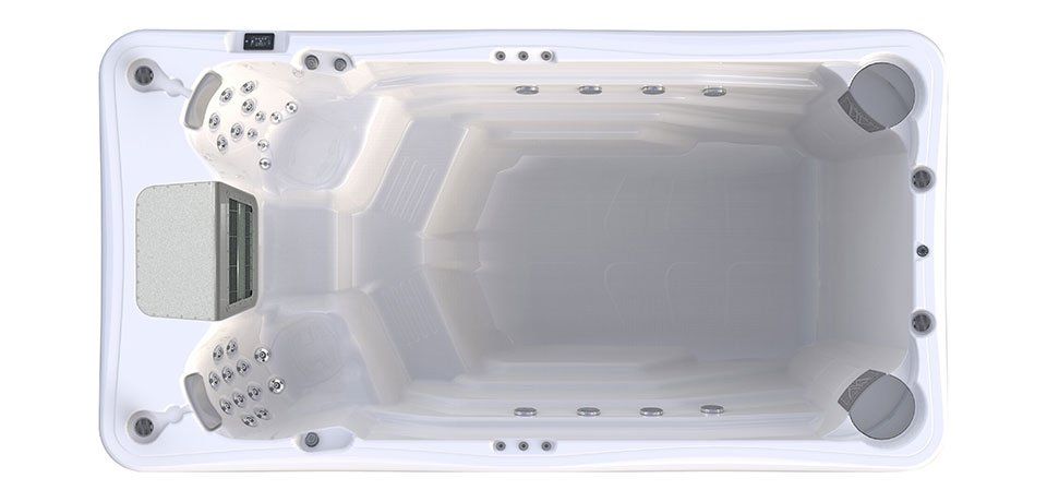 Top-down view of a white swim spa with seating and jets. Grey equipment is visible.