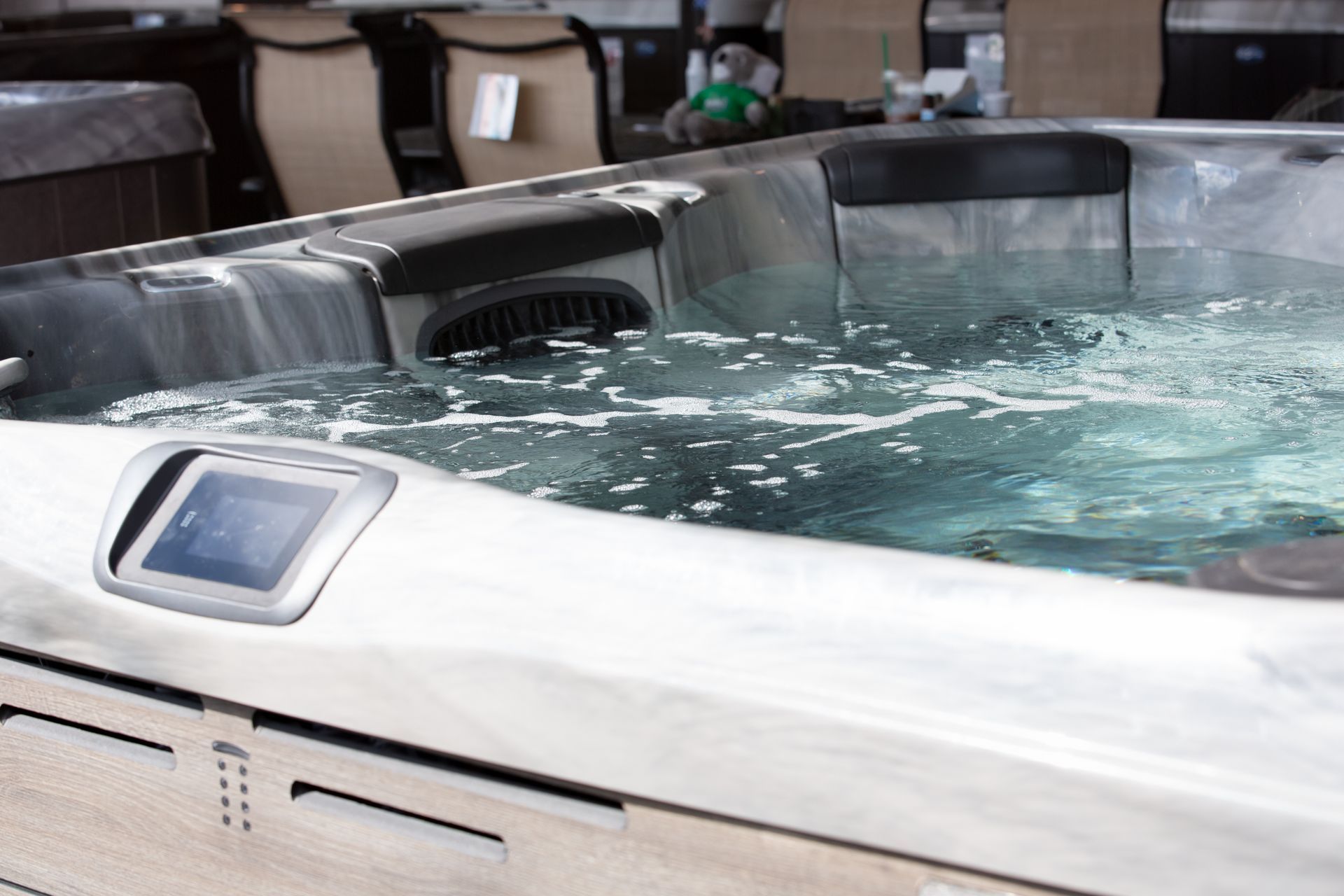 Modern spa displayed by a trusted hot tub supplier for home relaxation.