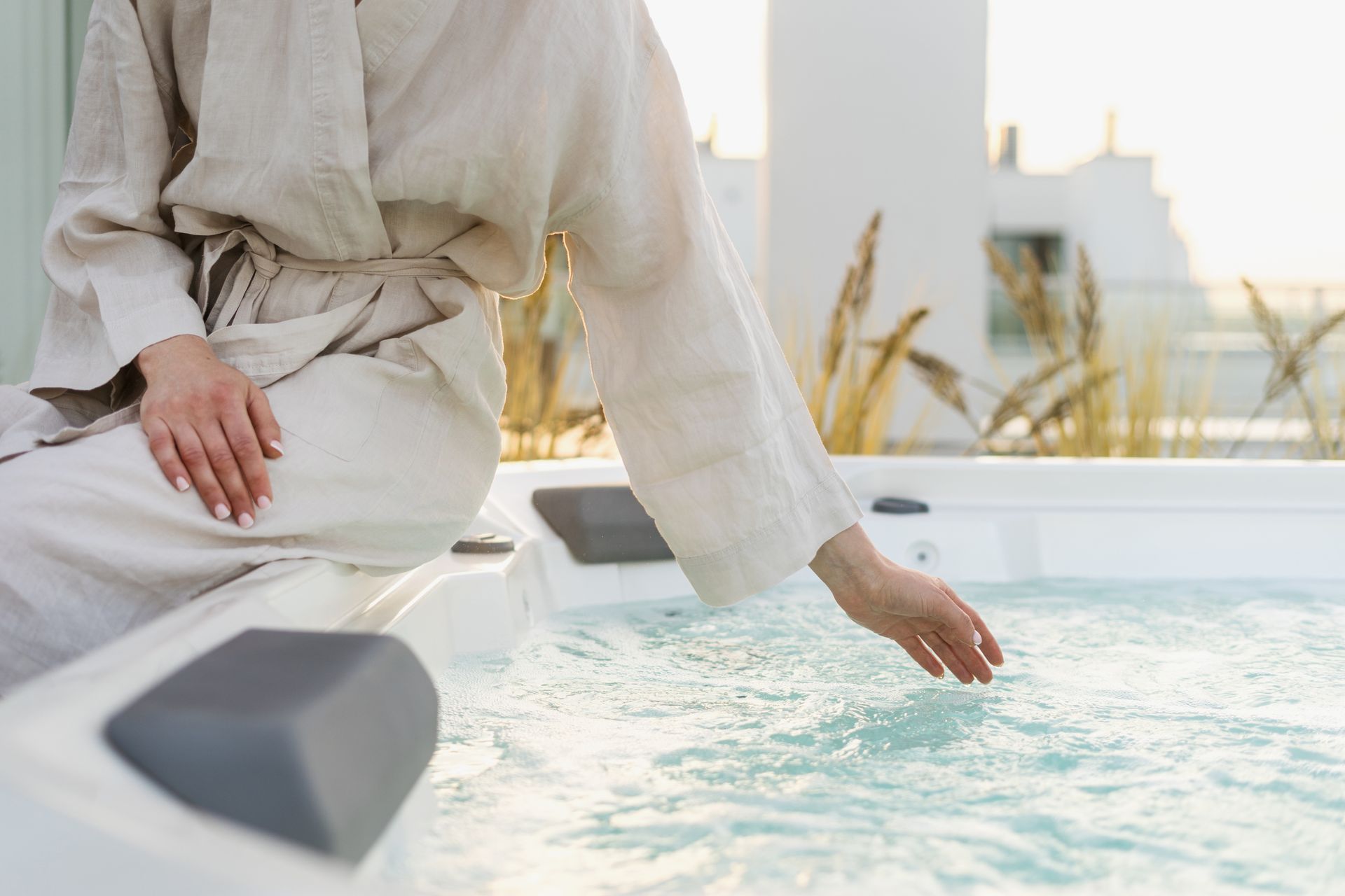 Person enjoying a tranquil outdoor hot tub, promoting relaxation and personal well-being.