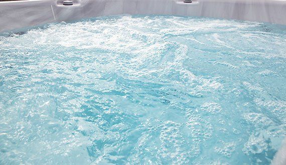 Bubbling blue hot tub water.