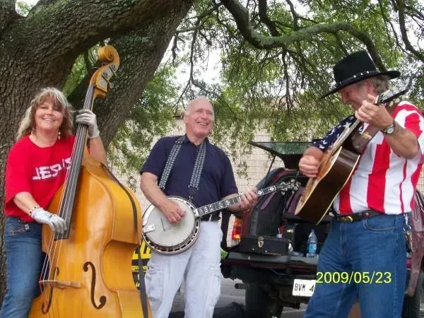 A man playing a banjo and a woman playing a double bass