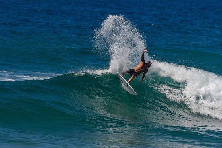 Man Having Fun Surfing — Slimes Boardstore in Erina, NSW
